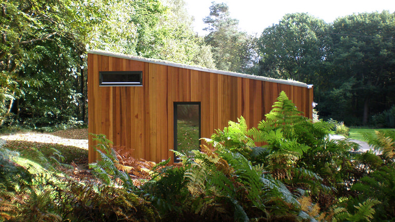 Side Facade of Ecospace Studio in Forest