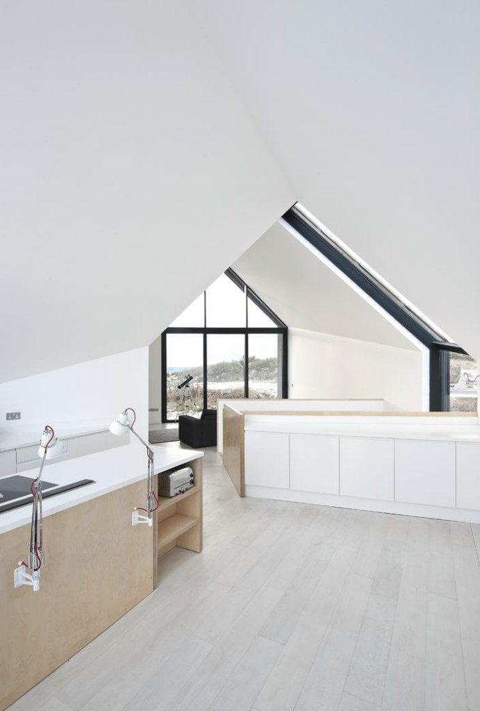 Minimalist Kitchen View Through to Living Room and Gable Shaped WIndow