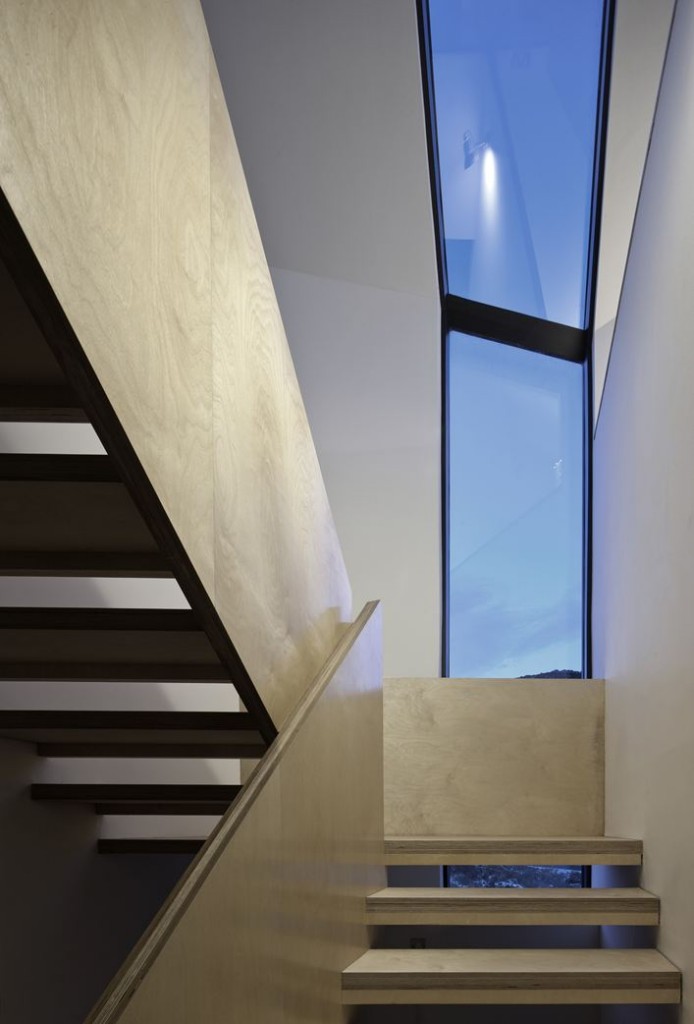 View up Staircase to Vertical Window in Evening