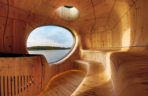 Grotto Sauna with a Curved Wood Interior by PARTISANS