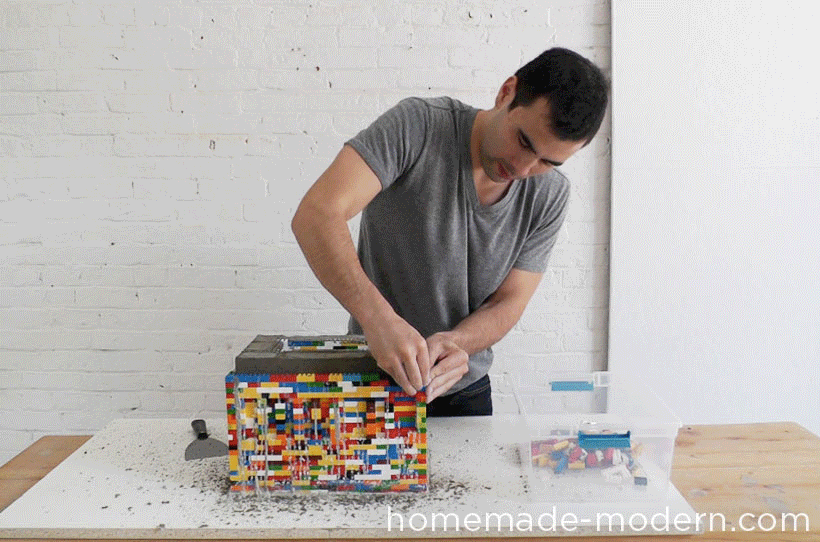 Removing the Lego Mould from the Cast Concrete Table