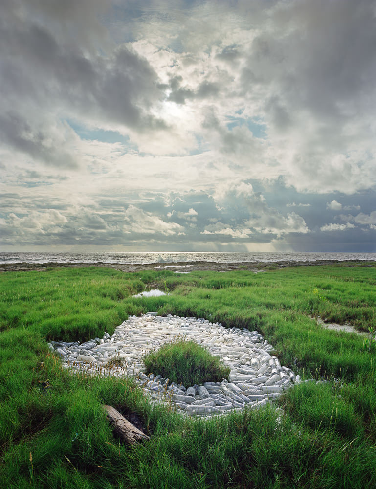 Plastic Bottles Floating in Marsh Land by Alejandro Duran in Washed Up Series