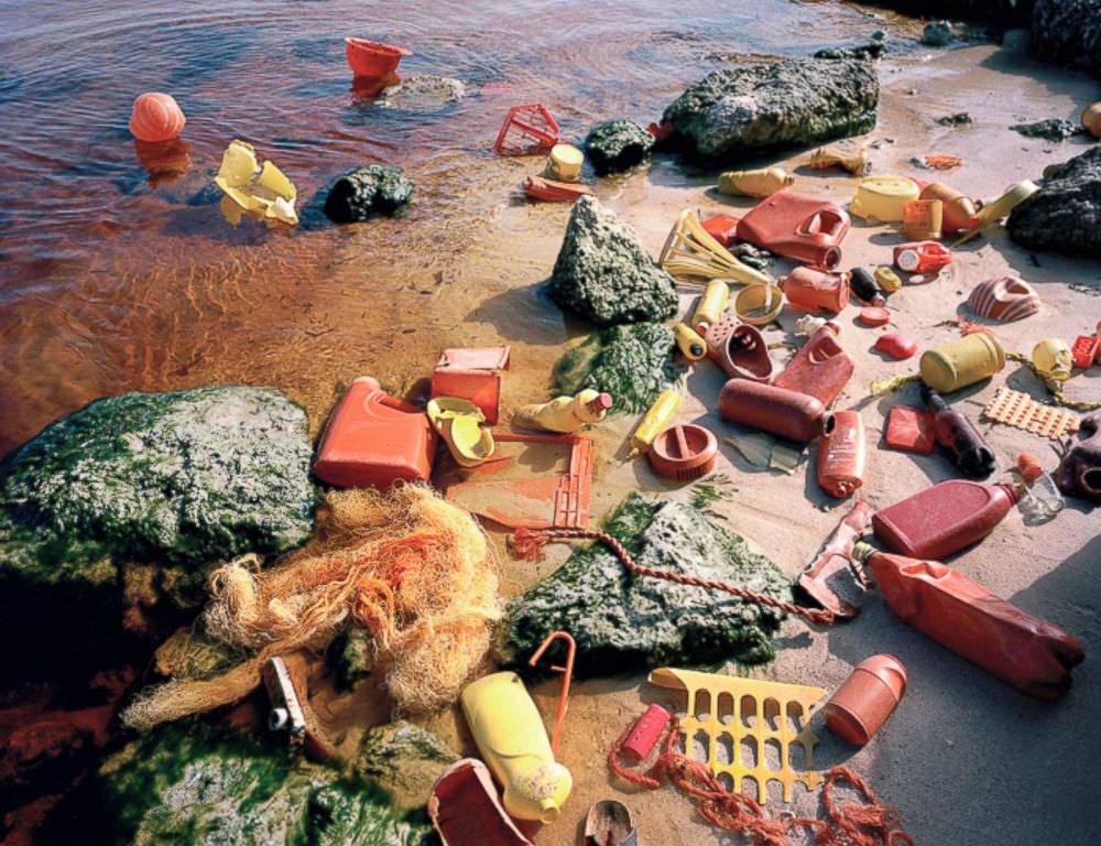 Red, Orange and Yellow Recovered Ocean Plastic Waste by Alejandro Duran