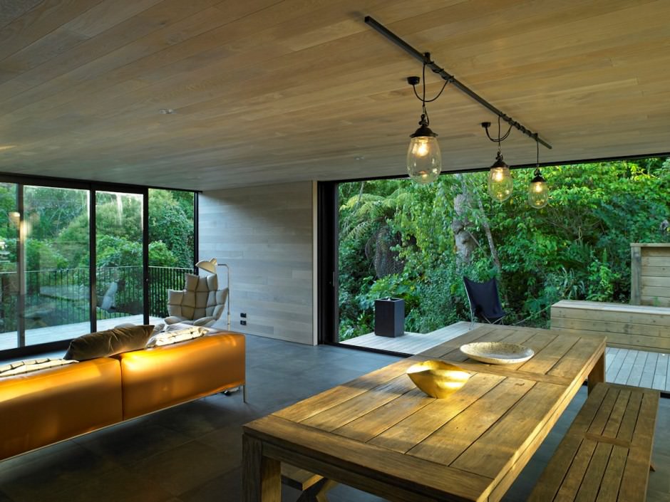 Interior and Roof Terraces of Waiatarua House with Green Surroundings