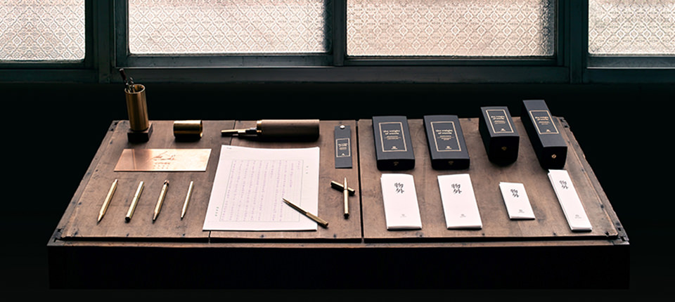 Ystudio Brass Pen Series on Table with Minimalist Packaging