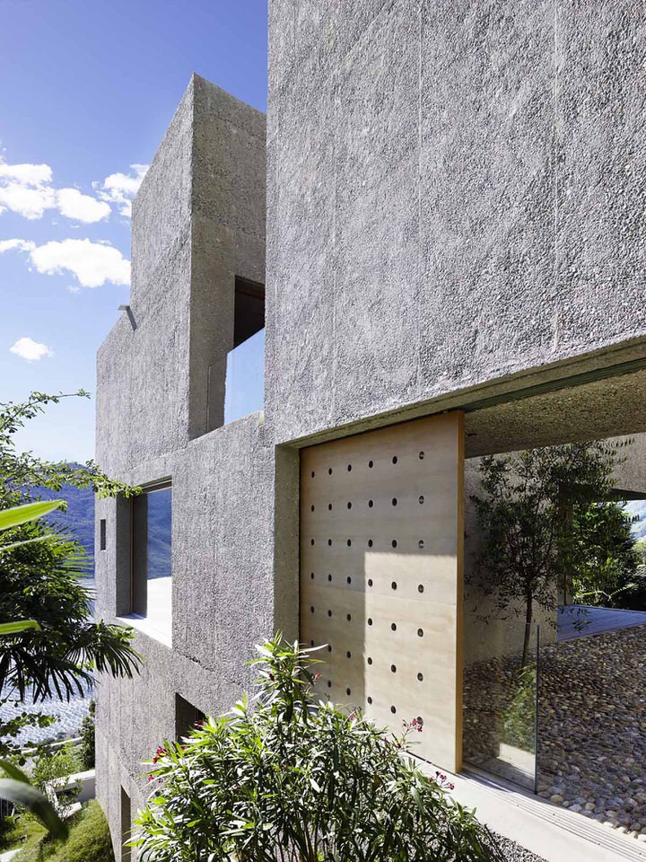 Side Facade of Vacation House in Brissago in Washed Concrete