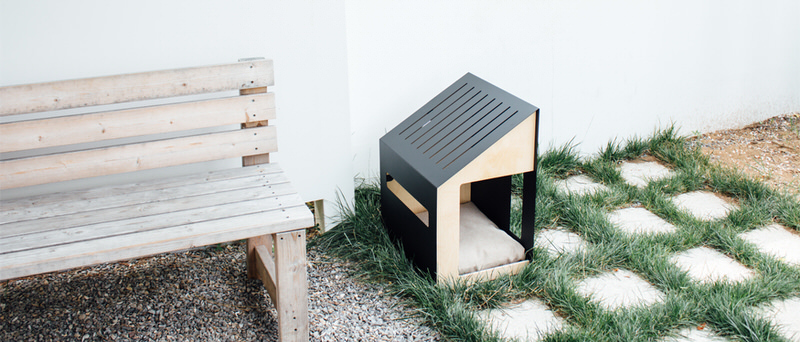 larvik-dog-house-in-minimalist-garden-by-bad-marlon
