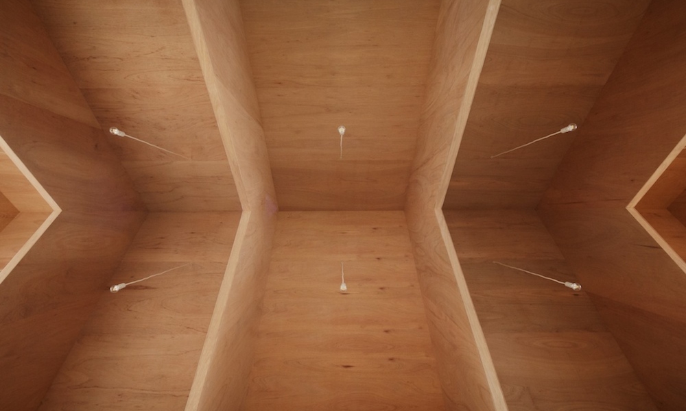 Plywood Geometric Triangular Roof with Minimalist Lighting