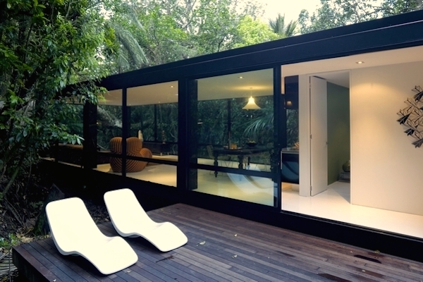Decking with Simple White Loungers of Forest House