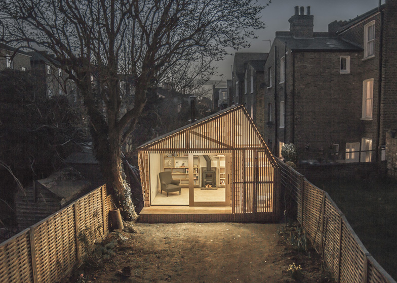Fairytale Writer's Shed by WSD Architecture Glowing in the Evening from a Distance