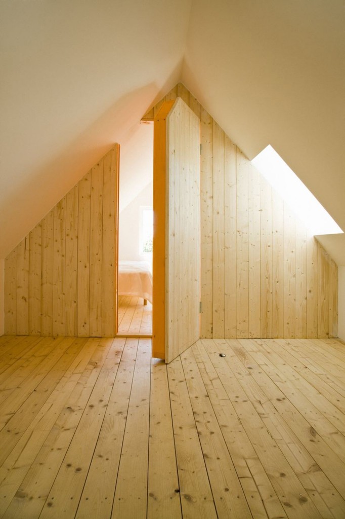 Hidden Room in Timber Clad Swedish Summer House Loft by LASC Studio