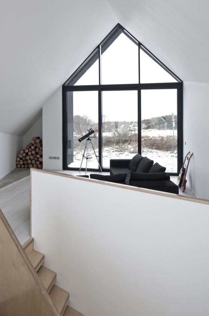 Minimalist Living Area with Huge Pitched Roof Gable Shaped Window