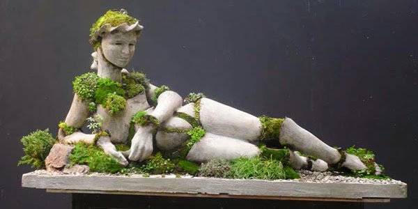 Laying Woman Concrete Plant Terraform Sculpture by Robert Cannon