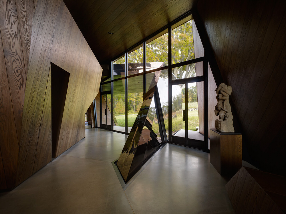 Entrance of 18.36.54 House with Bronzed Stainless Steel and Dark Stained Oak