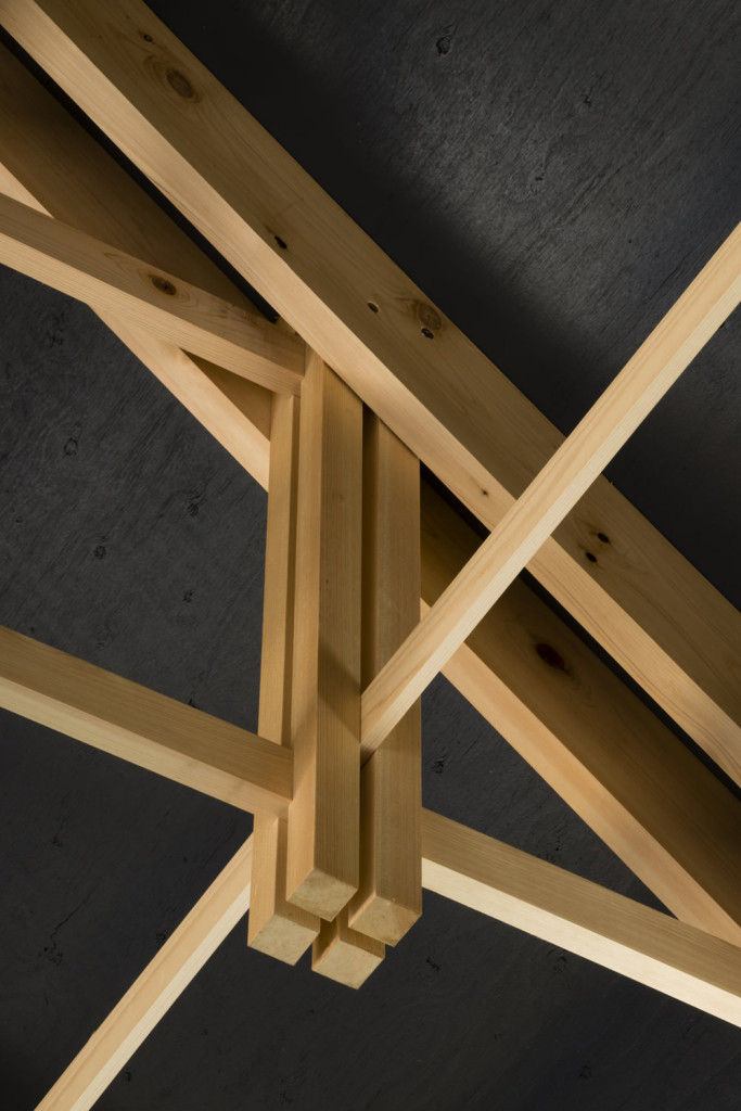 Narrow strips of timber in archery hall roof joinery resembles nocked arrow