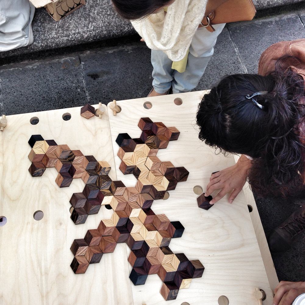 Playing Dominoes with The Grid Game Wooden Hexagons by Victor Aleman