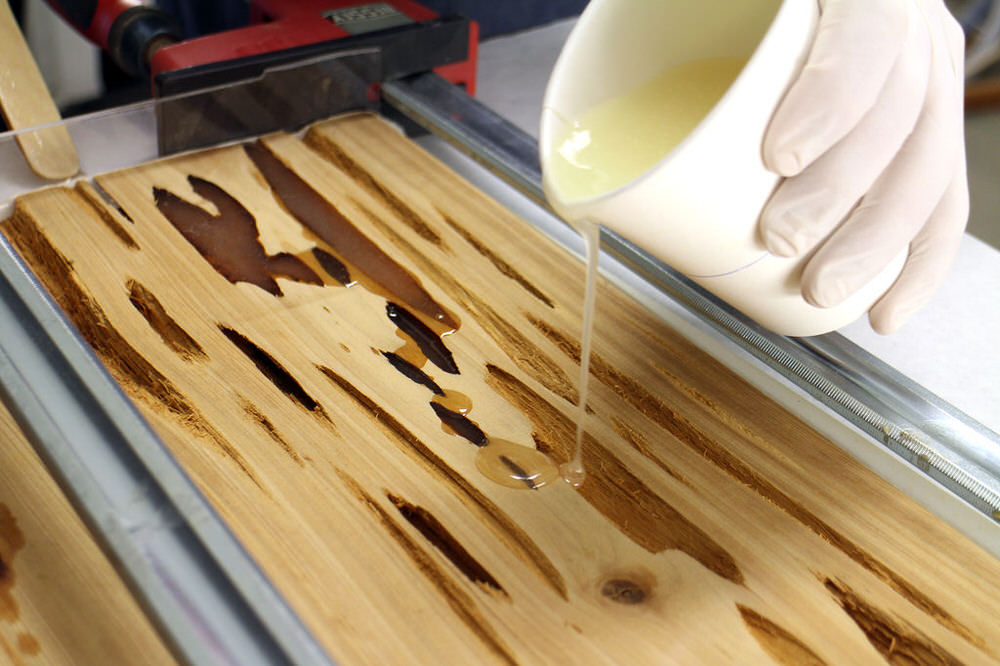 Pouring Resin into the Pecky Cypress Wood Voids