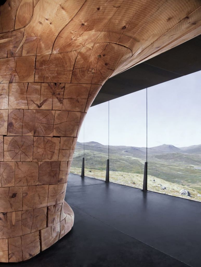 View of the Stacked Pine Beams in the Tverrfjellhytta Wild Reindeer Pavilion in Norway by Snøhetta
