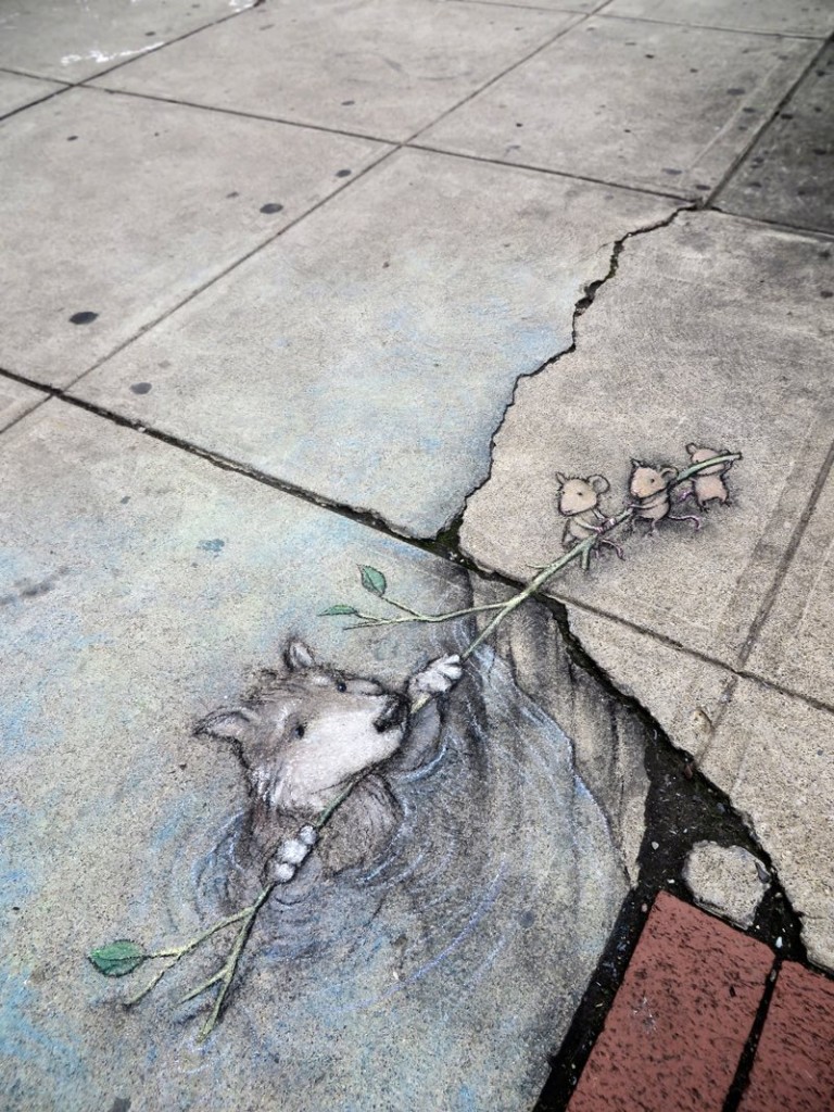 3 mice resucing a dog in trompe l'oeil street art by David Zinn in Michigan
