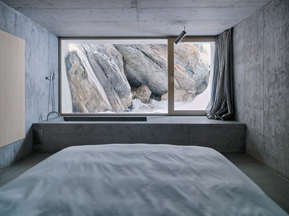Downstairs Concrete Bedroom and Bath Overlooking Cliffside