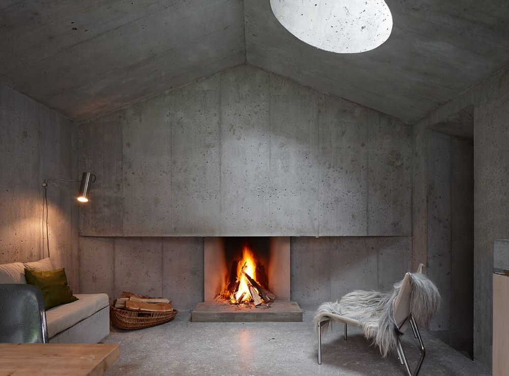Minimalist Concrete Living Room Fireplace in Refugi Lieptgas
