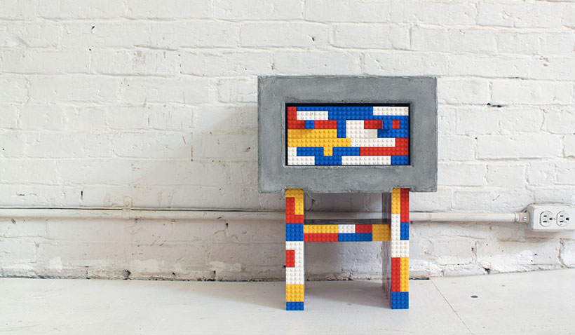 Red, White, Yellow, and Blue Lego and Concrete Table