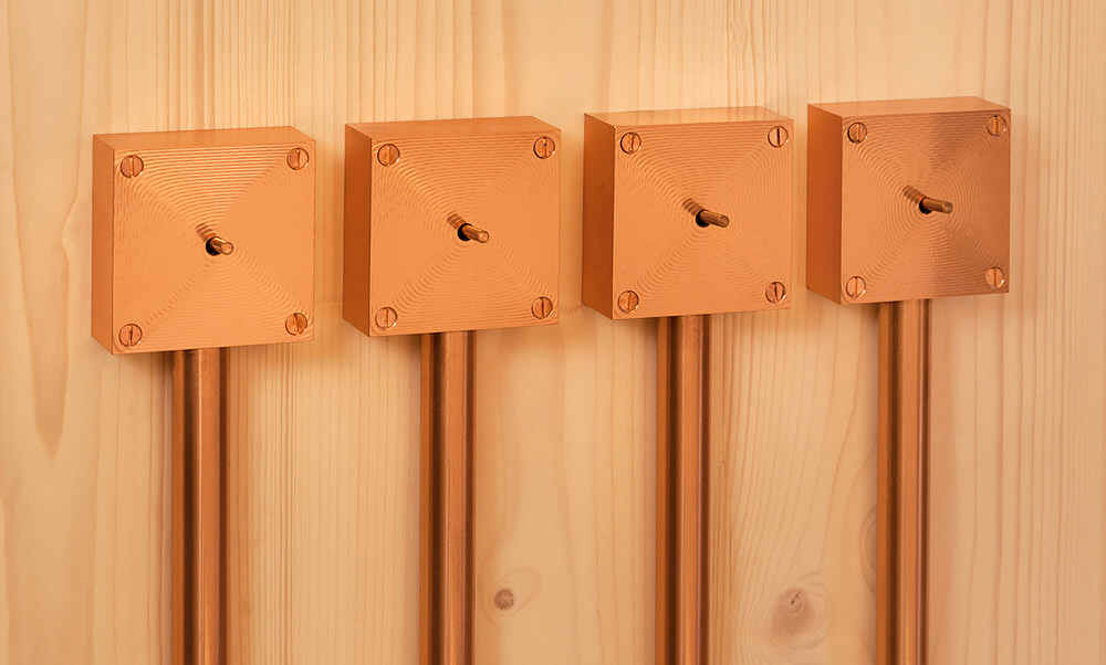 Copper Light Switches of Timber House by KÜHNLEIN Architektur