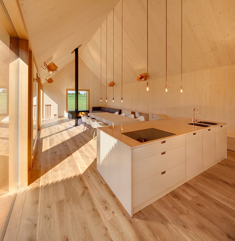 Copper and Wood Interior of Timber House by KÜHNLEIN Architektur
