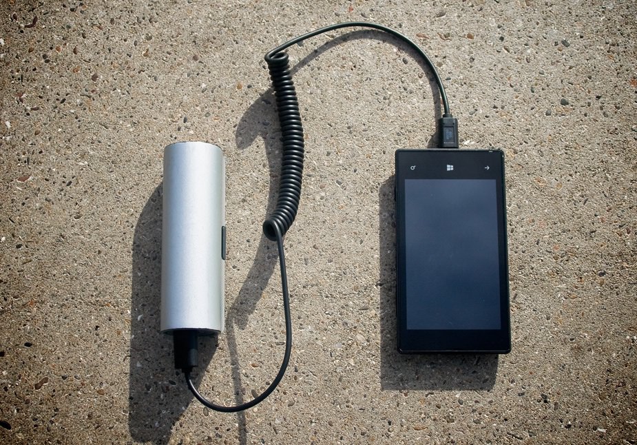 Smartphone Plugged into WAACS Rollable Solar Charger