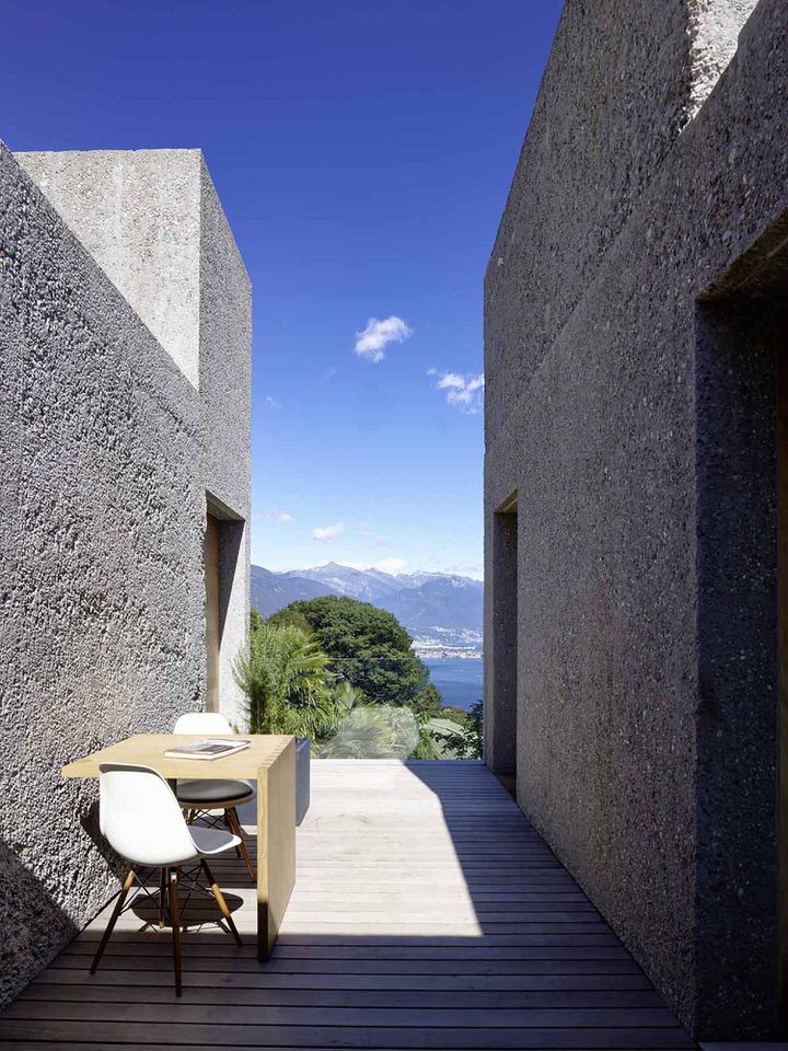 View Through House in Brissago over Swiss Landscape with Eames DSW Chairs