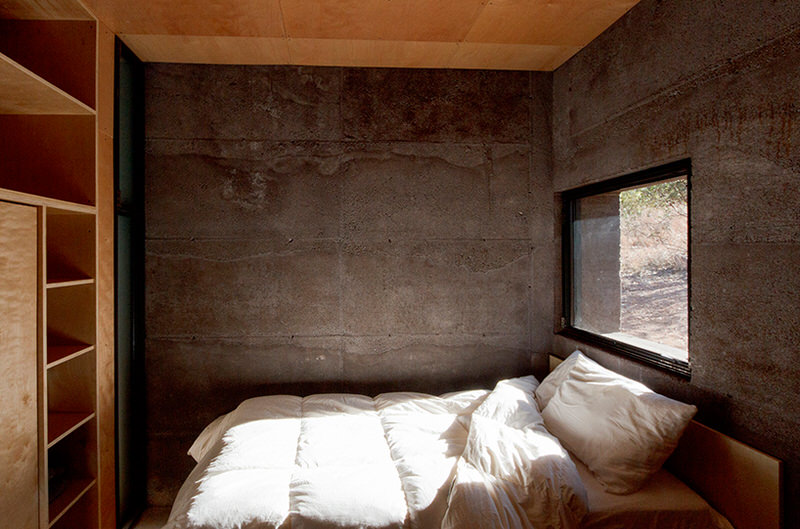 Bedroom of Casa Caldera with Built in Storage and Lavacrete Walls